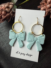 Load image into Gallery viewer, Blue Bow Dangle Earrings
