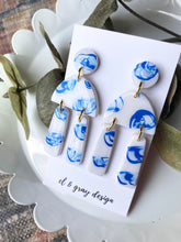 Load image into Gallery viewer, Hand Painted Dangle Earrings in White &amp; Blue
