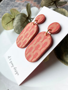 Rusty Oval Earrings With Golden Arch Details